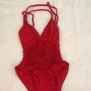 Red one piece with crochet cut out and tie back